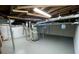 Unfinished basement area showing painted floor and open ceiling structure at 25 Gladstone Sw Dr, Marietta, GA 30060