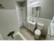 Clean bathroom with tile surround, and a standard vanity and toilet at 25 Gladstone Sw Dr, Marietta, GA 30060