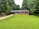 Charming brick ranch home with mature landscaping, level lot and covered parking at 25 Gladstone Sw Dr, Marietta, GA 30060