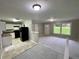 Inviting living area connecting to a modern kitchen with black appliances at 25 Gladstone Sw Dr, Marietta, GA 30060