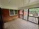 Relaxing screened porch offering a seamless transition to the deck at 25 Gladstone Sw Dr, Marietta, GA 30060