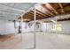 Unfinished basement with exposed wood beams and plenty of space at 504 Milligan Dr, Stone Mountain, GA 30083