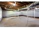 Spacious unfinished basement with concrete flooring, white-painted walls, and exposed ceiling, ready to be customized at 504 Milligan Dr, Stone Mountain, GA 30083