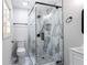 Modern bathroom with a glass shower, elegant tile, and contemporary fixtures at 504 Milligan Dr, Stone Mountain, GA 30083