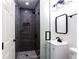 Updated bathroom with a tiled shower, sleek fixtures, and modern lighting at 504 Milligan Dr, Stone Mountain, GA 30083