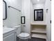 Cozy bathroom featuring sleek black hardware, a shower with glass door, and modern fixtures at 504 Milligan Dr, Stone Mountain, GA 30083