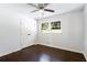 Sun-filled bedroom with hardwood floors, closet, and a large window offering a picturesque view at 504 Milligan Dr, Stone Mountain, GA 30083