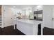 Modern kitchen with white cabinetry, stainless steel appliances, and quartz countertops at 504 Milligan Dr, Stone Mountain, GA 30083