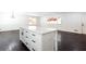 Kitchen with white island, cabinets, black hardware, and stainless steel appliances at 504 Milligan Dr, Stone Mountain, GA 30083