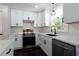 Updated kitchen with white cabinets, stainless steel appliances, and modern fixtures at 504 Milligan Dr, Stone Mountain, GA 30083