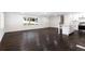 Large living room with hardwood floors connecting living and kitchen areas at 504 Milligan Dr, Stone Mountain, GA 30083