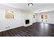 Bright living room with a brick fireplace and french doors leading to the backyard at 504 Milligan Dr, Stone Mountain, GA 30083