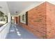 Charming red brick home with a welcoming covered front porch, perfect for enjoying the outdoors in comfort and style at 504 Milligan Dr, Stone Mountain, GA 30083