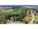 Aerial view of the home at 2373 Oak Falls Lane, Buford, GA surrounded by lush trees and greenery at 2373 Oak Falls Ln, Buford, GA 30519