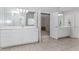 A Jack and Jill bathroom has separate vanities and plenty of storage space, and connects the bedrooms at 2373 Oak Falls Ln, Buford, GA 30519