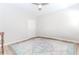 Bedroom featuring a ceiling fan and neutral decor with wood-style floors at 2373 Oak Falls Ln, Buford, GA 30519