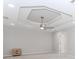 A bedroom is brightened by recessed lights and the tray ceiling with ceiling fan adds dimension at 2373 Oak Falls Ln, Buford, GA 30519