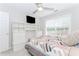 Bedroom with a bed, a built-in desk, shelves, and a window for natural light at 2373 Oak Falls Ln, Buford, GA 30519