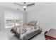Bedroom with a window for natural light featuring a desk and a bed at 2373 Oak Falls Ln, Buford, GA 30519