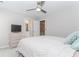 A bedroom features a ceiling fan, a TV, and has access to a bathroom at 2373 Oak Falls Ln, Buford, GA 30519