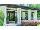 Inviting front porch features classic columns and stylish décor, adding to the home's charm at 2373 Oak Falls Ln, Buford, GA 30519