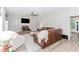 Cozy living room featuring a fireplace, leather sofa, and neutral decor at 2373 Oak Falls Ln, Buford, GA 30519
