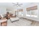 Inviting living room with large windows, comfortable seating, and view of the kitchen at 2373 Oak Falls Ln, Buford, GA 30519