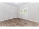 Bright room with French doors and wood-style floors at 2373 Oak Falls Ln, Buford, GA 30519