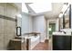 Bright bathroom featuring a tiled shower, soaking tub with tile surround, and double sink vanity with framed mirrors at 349 Harris Loop, Dallas, GA 30157
