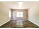 Bright bonus room featuring hardwood floors, neutral walls, and a sunny window view at 349 Harris Loop, Dallas, GA 30157