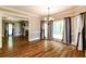 Dining room with hardwood floors, large windows, and a chandelier at 349 Harris Loop, Dallas, GA 30157