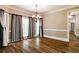 Dining room boasts hardwood floors, neutral walls, and large windows for natural light at 349 Harris Loop, Dallas, GA 30157