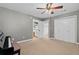 Open bedroom with piano, a ceiling fan, and ensuite access at 4004 Charrwood Trce, Marietta, GA 30062