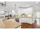 Modern kitchen with stainless steel appliances, granite countertops, white cabinetry and seamless access to living spaces at 4004 Charrwood Trce, Marietta, GA 30062