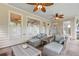 Relaxing screened-in porch with cushioned seating, ceiling fans, and an inviting ambiance for gatherings at 4004 Charrwood Trce, Marietta, GA 30062