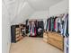 Spacious walk-in closet with custom shelving and ample storage for clothing and shoes at 4004 Charrwood Trce, Marietta, GA 30062