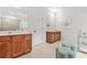 This bathroom features dual vanities and a large mirror at 625 St Annes Pl, Covington, GA 30016