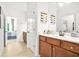 Bathroom with wood cabinets and views into the bedroom at 625 St Annes Pl, Covington, GA 30016