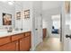 Bathroom with wood cabinets and decor at 625 St Annes Pl, Covington, GA 30016