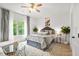 Bright bedroom with ceiling fan and stylish decor at 625 St Annes Pl, Covington, GA 30016