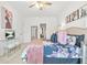 Bright bedroom with ceiling fan, modern decor, and furniture at 625 St Annes Pl, Covington, GA 30016