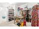 Walk-in closet with shelving for shoes and racks for hanging clothes at 625 St Annes Pl, Covington, GA 30016