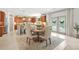 Bright dining area featuring a cozy round table and kitchen with stainless appliances at 625 St Annes Pl, Covington, GA 30016