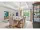 Elegant dining room with modern chandelier and views into office area at 625 St Annes Pl, Covington, GA 30016