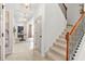 Welcoming entryway with a staircase, stylish lighting, and a view to the front door at 625 St Annes Pl, Covington, GA 30016