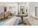 Elegant foyer featuring a stylish round table, ornate decor, and bright lighting at 625 St Annes Pl, Covington, GA 30016