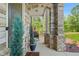 Charming front porch with stone pillars and accents, offering a welcoming entrance at 625 St Annes Pl, Covington, GA 30016
