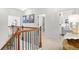 Upstairs hallway featuring black iron railings and views into the bedrooms at 625 St Annes Pl, Covington, GA 30016
