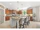 Kitchen island with granite countertop, bar stools and open layout at 625 St Annes Pl, Covington, GA 30016