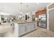 Open concept kitchen with granite island, stainless steel appliances, and breakfast area at 625 St Annes Pl, Covington, GA 30016